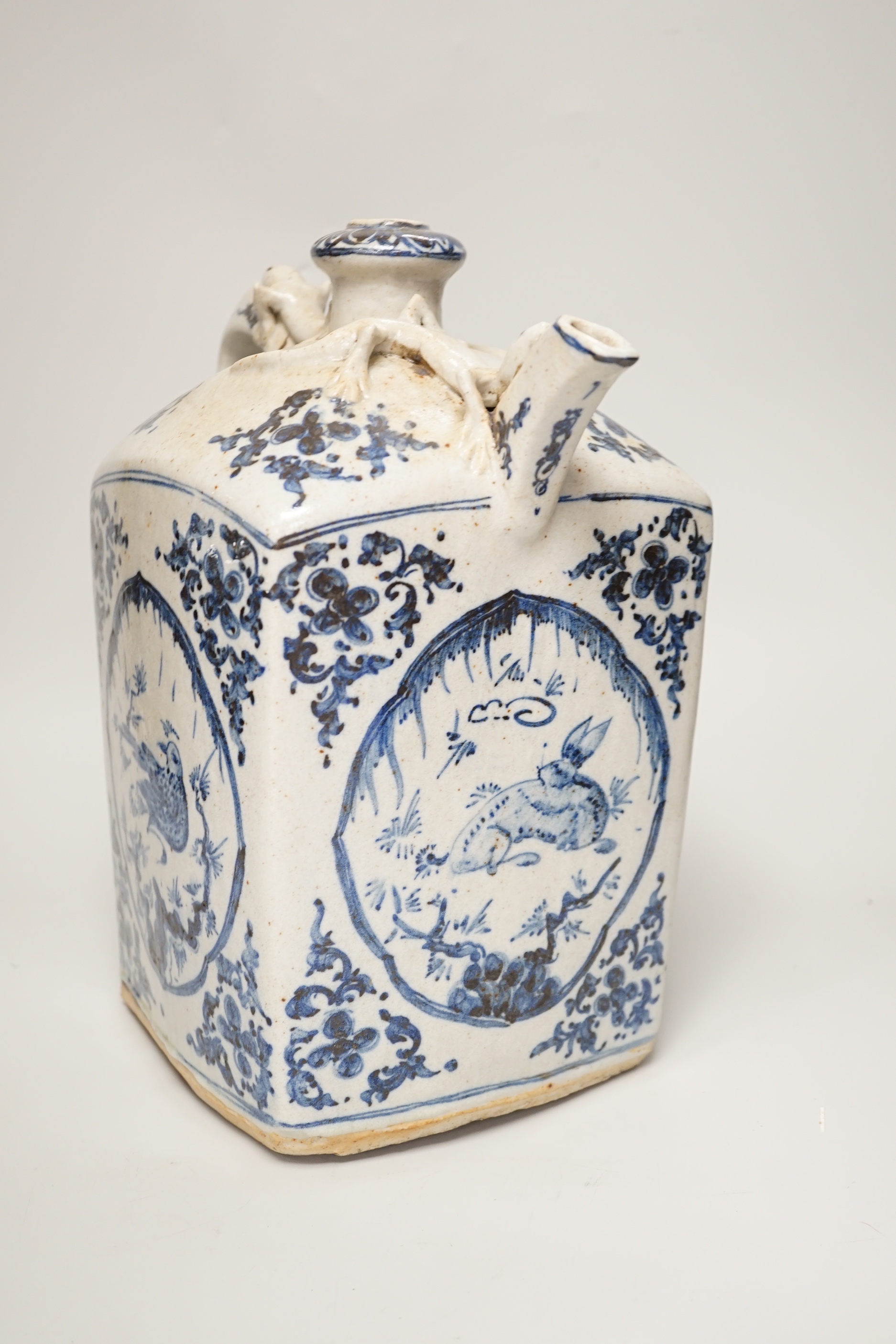 A blue and white Chinese pottery teapot, 31cm high